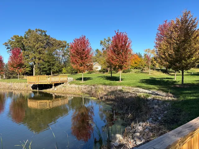 a view of a lake with a yard