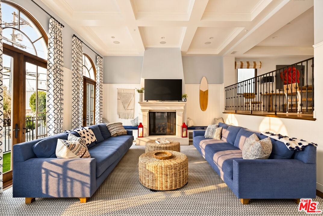 17 Privateer Street Marina del Rey, CA 90292 - Photo 1 of 47 a living room with fireplace furniture and a large window