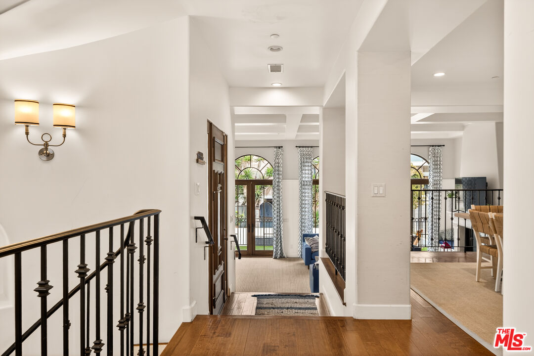 17 Privateer Street Marina del Rey, CA 90292 - Photo 12 of 47 a view of a hallway with wooden floor and staircase