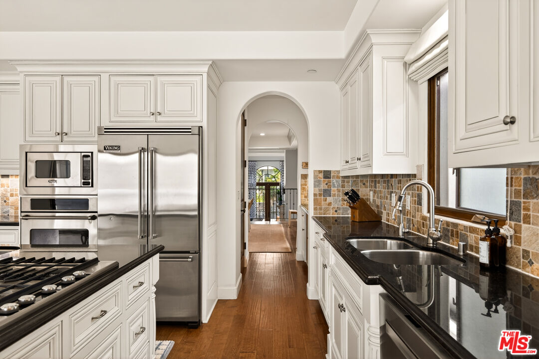 17 Privateer Street Marina del Rey, CA 90292 - Photo 23 of 47 a kitchen with stainless steel appliances granite countertop a stove a sink and a refrigerator