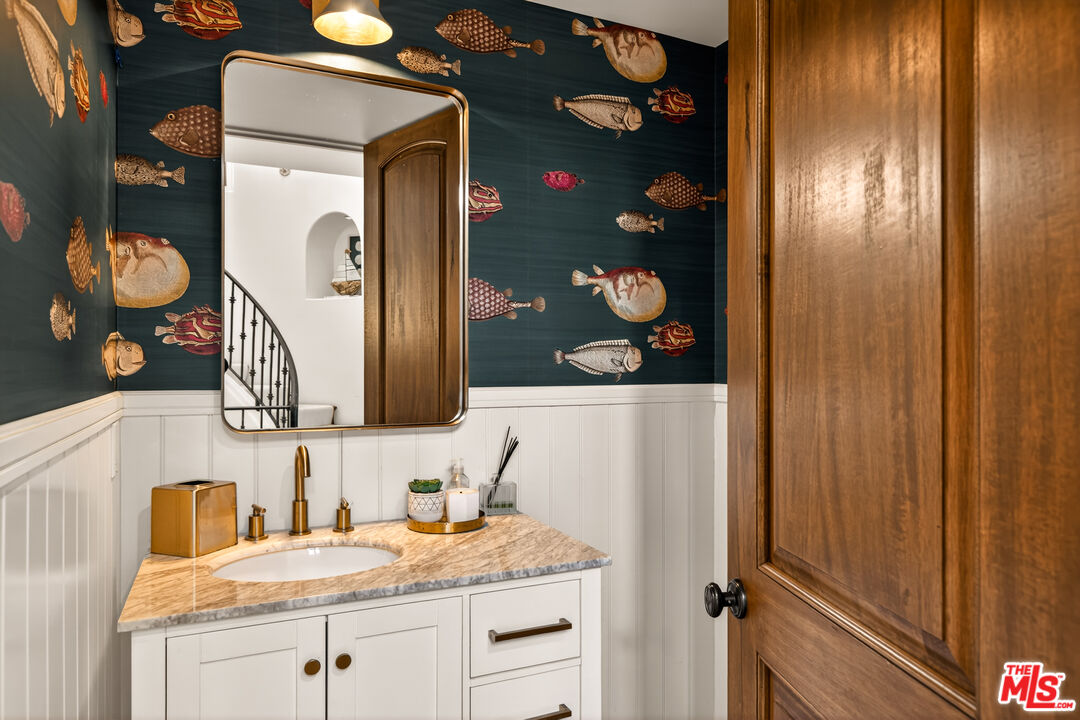 17 Privateer Street Marina del Rey, CA 90292 - Photo 25 of 47 a bathroom with a granite countertop sink and a mirror