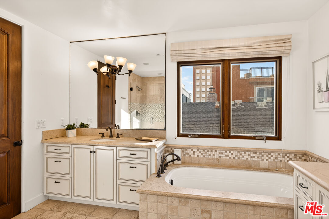 17 Privateer Street Marina del Rey, CA 90292 - Photo 31 of 47 a bathroom with a tub sink and mirror