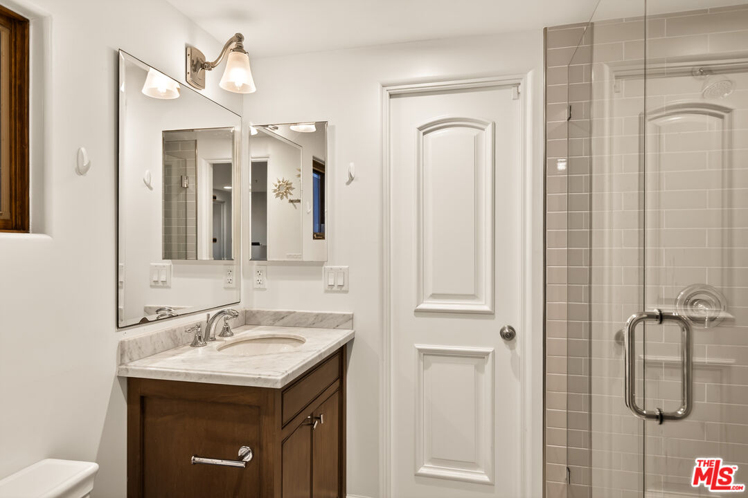 17 Privateer Street Marina del Rey, CA 90292 - Photo 44 of 47 a bathroom with a granite countertop sink a toilet and shower