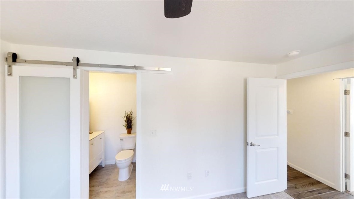 17849 Danby Drive Southwest Rochester, WA 98579 - Photo 22 of 23 a bathroom with a granite countertop shower and a toilet