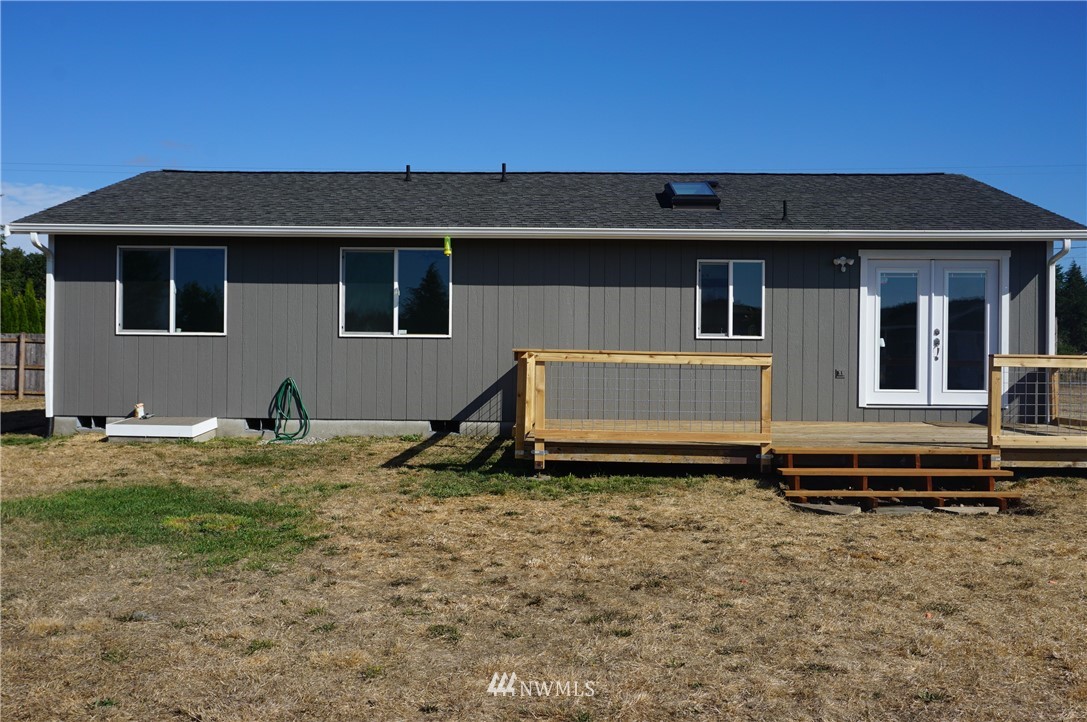 17849 Danby Drive Southwest Rochester, WA 98579 - Photo 5 of 23 a view of a house with a backyard