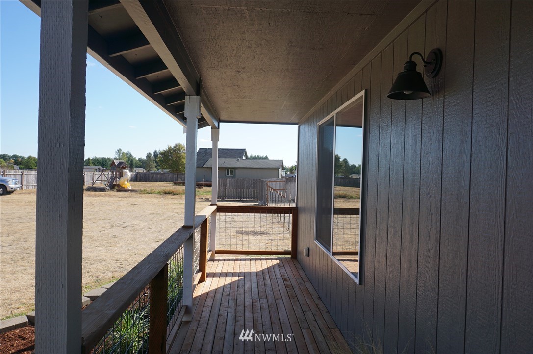 17849 Danby Drive Southwest Rochester, WA 98579 - Photo 6 of 23 a view of a balcony with wooden floor