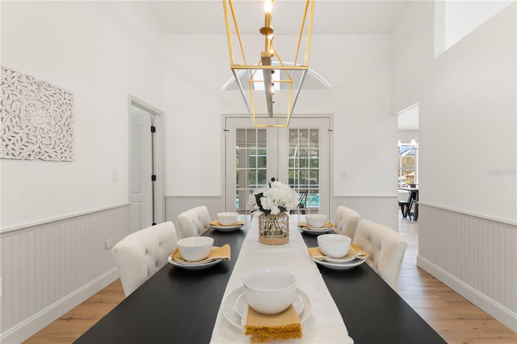 419 Silas Court Spring Hill, FL 34609 - Photo 11 of 56 a living room with furniture and a chandelier