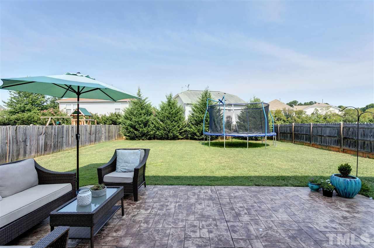167 Solheim Lane Raleigh, NC 27603 - Photo 2 of 25 a view of a chairs in a backyard
