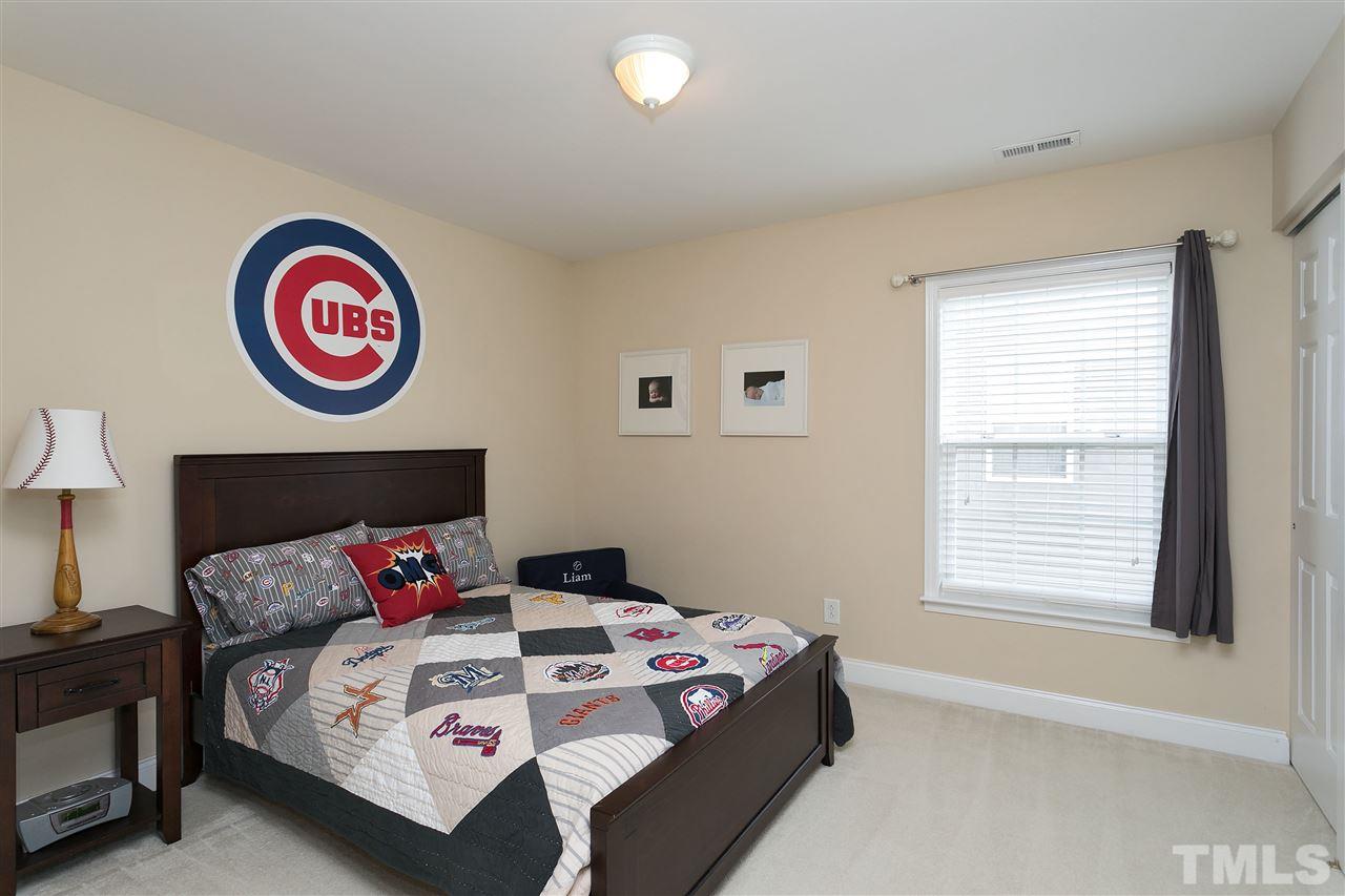 167 Solheim Lane Raleigh, NC 27603 - Photo 13 of 25 a bedroom with a bed and a window