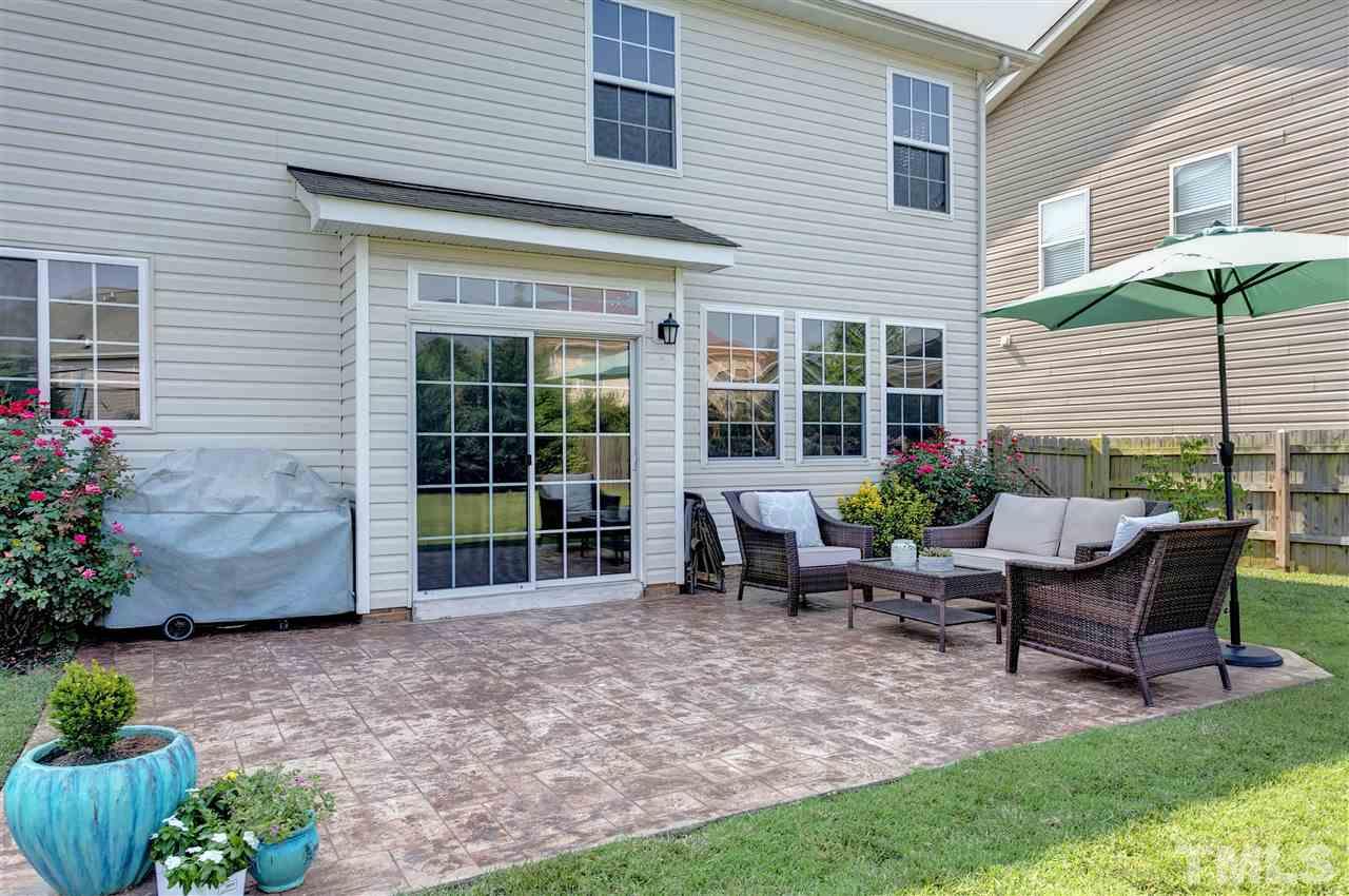 167 Solheim Lane Raleigh, NC 27603 - Photo 19 of 25 a view of a house with backyard sitting area and garden