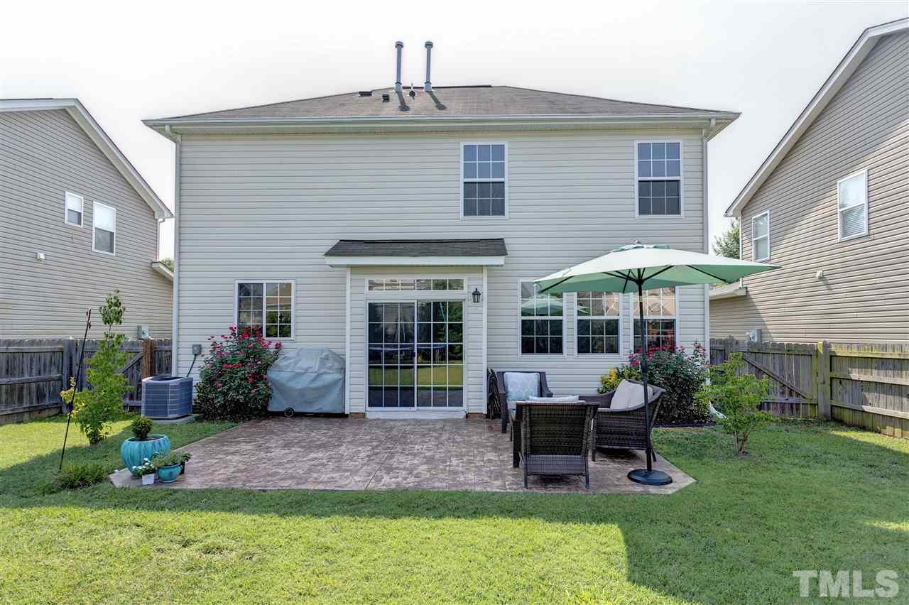 167 Solheim Lane Raleigh, NC 27603 - Photo 20 of 25 a view of a house with a yard and sitting area