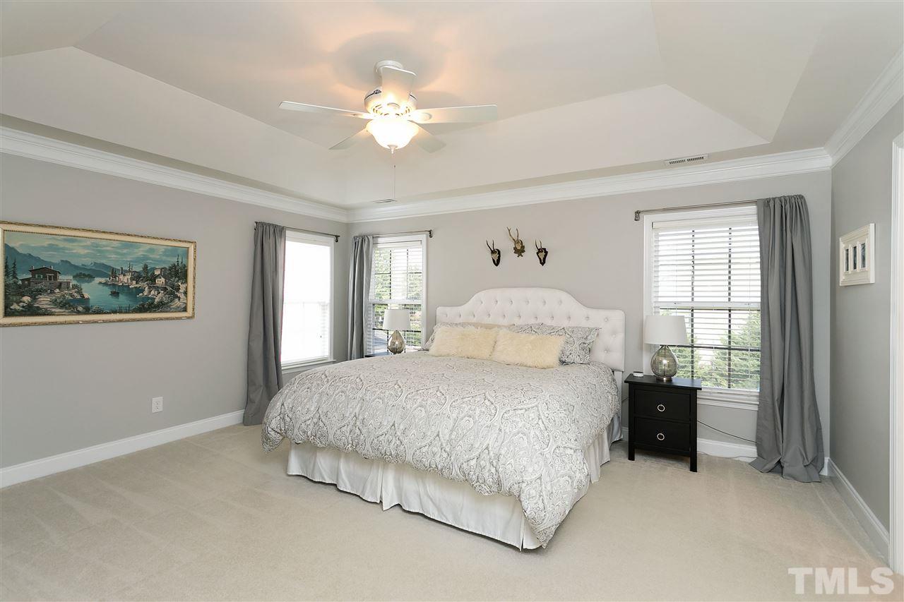 167 Solheim Lane Raleigh, NC 27603 - Photo 10 of 25 a bedroom with a bed and window