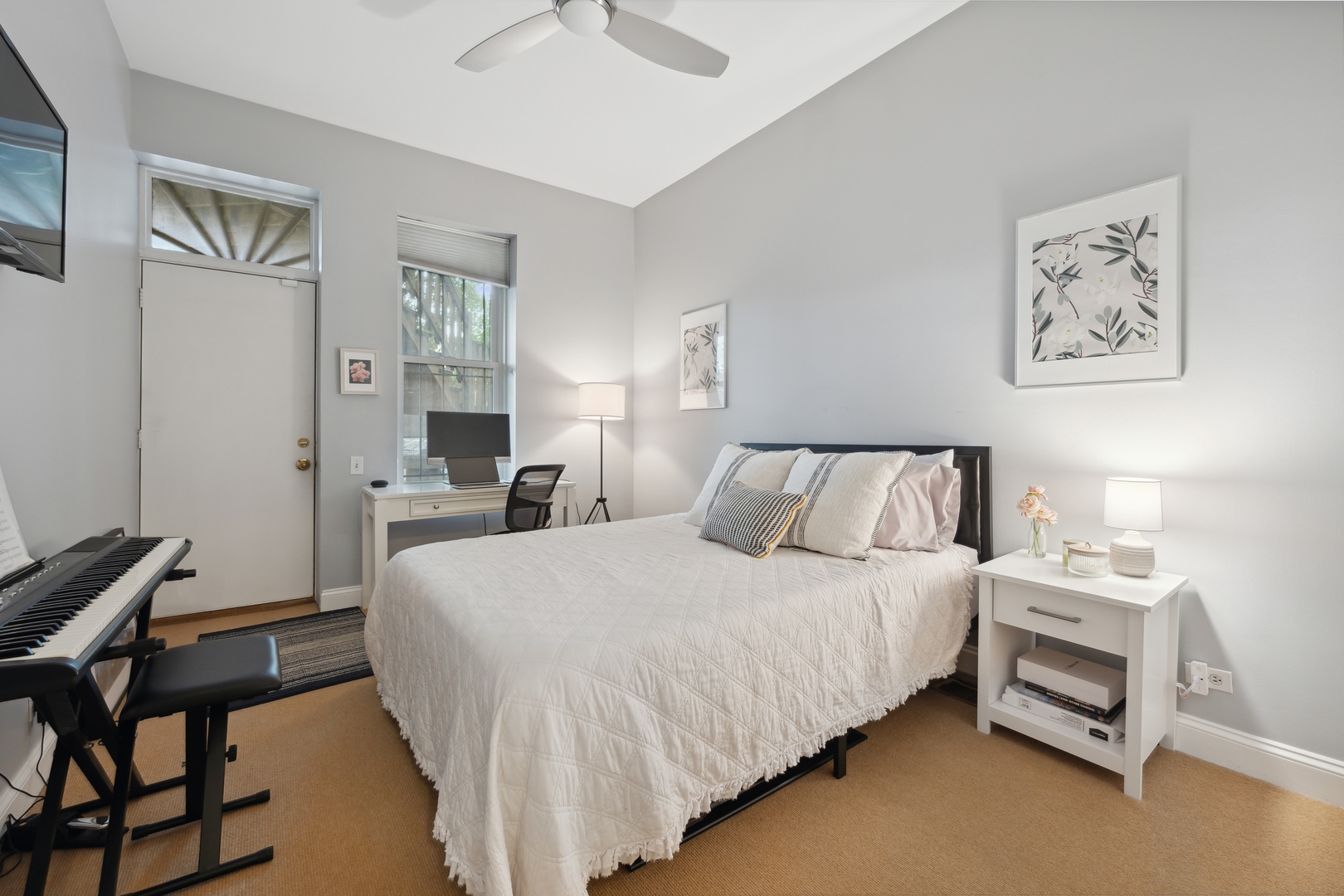 1667 North Bissell Street, Unit 2 Chicago, IL 60614 - Photo 11 of 14 a bedroom with a bed and a lamp on the dresser