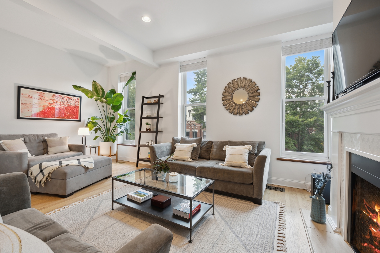 1667 North Bissell Street, Unit 2 Chicago, IL 60614 - Photo 2 of 14 a living room with furniture a fireplace and a flat screen tv
