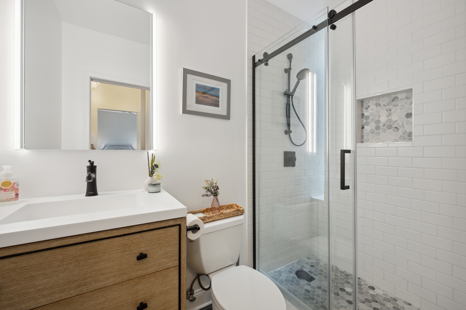 1667 North Bissell Street, Unit 2 Chicago, IL 60614 - Photo 10 of 14 a bathroom with a sink a toilet and shower