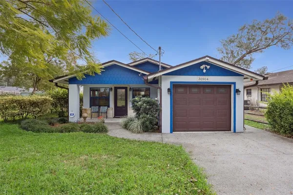 front view of a house with a yard