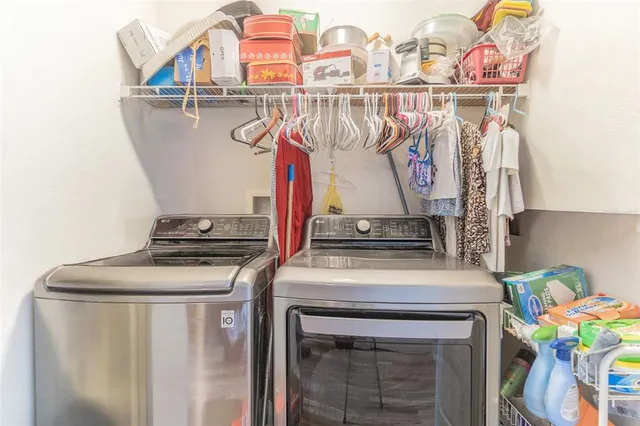 a utility room with dryer and washer