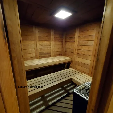 a view of room with wooden floor