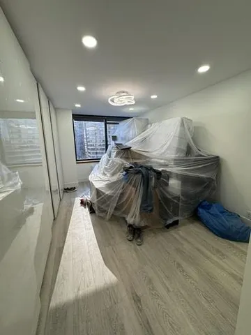 a white toilet sitting next to a bathroom sink