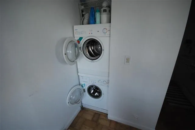 a bed room with furniture and a wooden floor