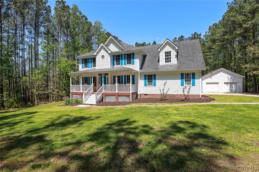 a view of a house with a backyard porch and sitting area