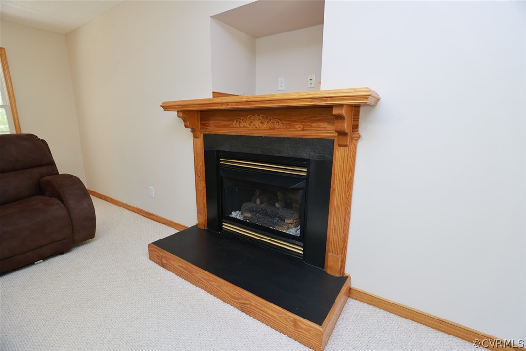7100 Hair Road Disputanta, VA 23842 - Photo 14 of 40 a living room with furniture and a fireplace