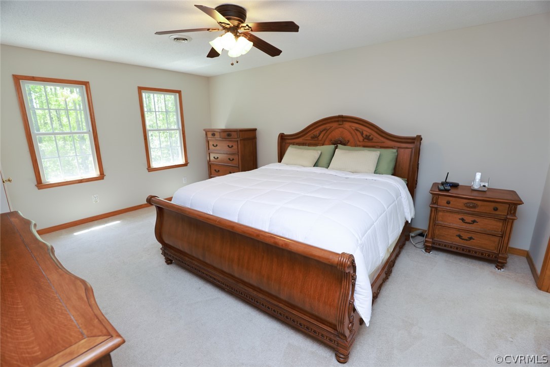 7100 Hair Road Disputanta, VA 23842 - Photo 16 of 40 a bedroom with a bed and wooden floor