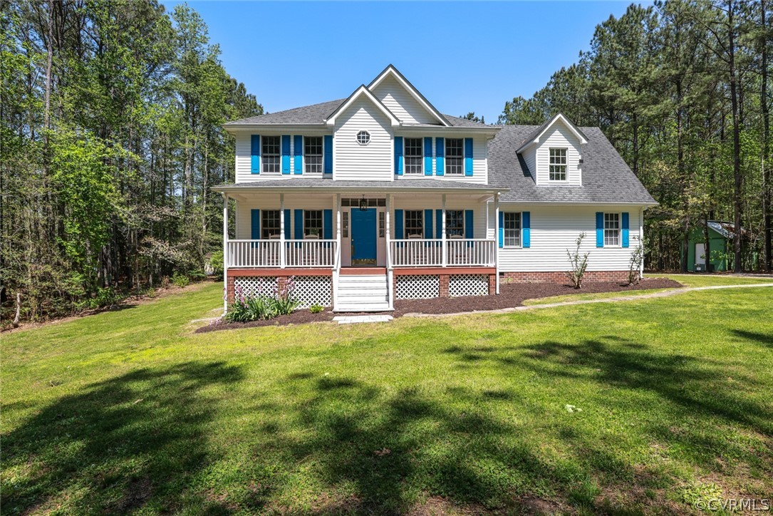 7100 Hair Road Disputanta, VA 23842 - Photo 40 of 40 a front view of a house with a garden