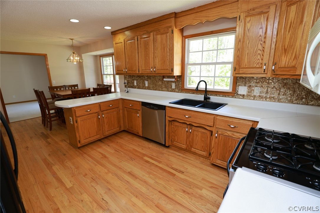 7100 Hair Road Disputanta, VA 23842 - Photo 9 of 40 a kitchen with stainless steel appliances granite countertop a sink stove and refrigerator