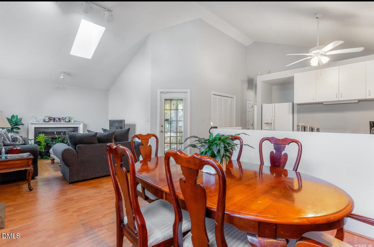 721 Banks Street Graham, NC 27253 - Photo 2 of 4 a living room with furniture kitchen view and a chandelier