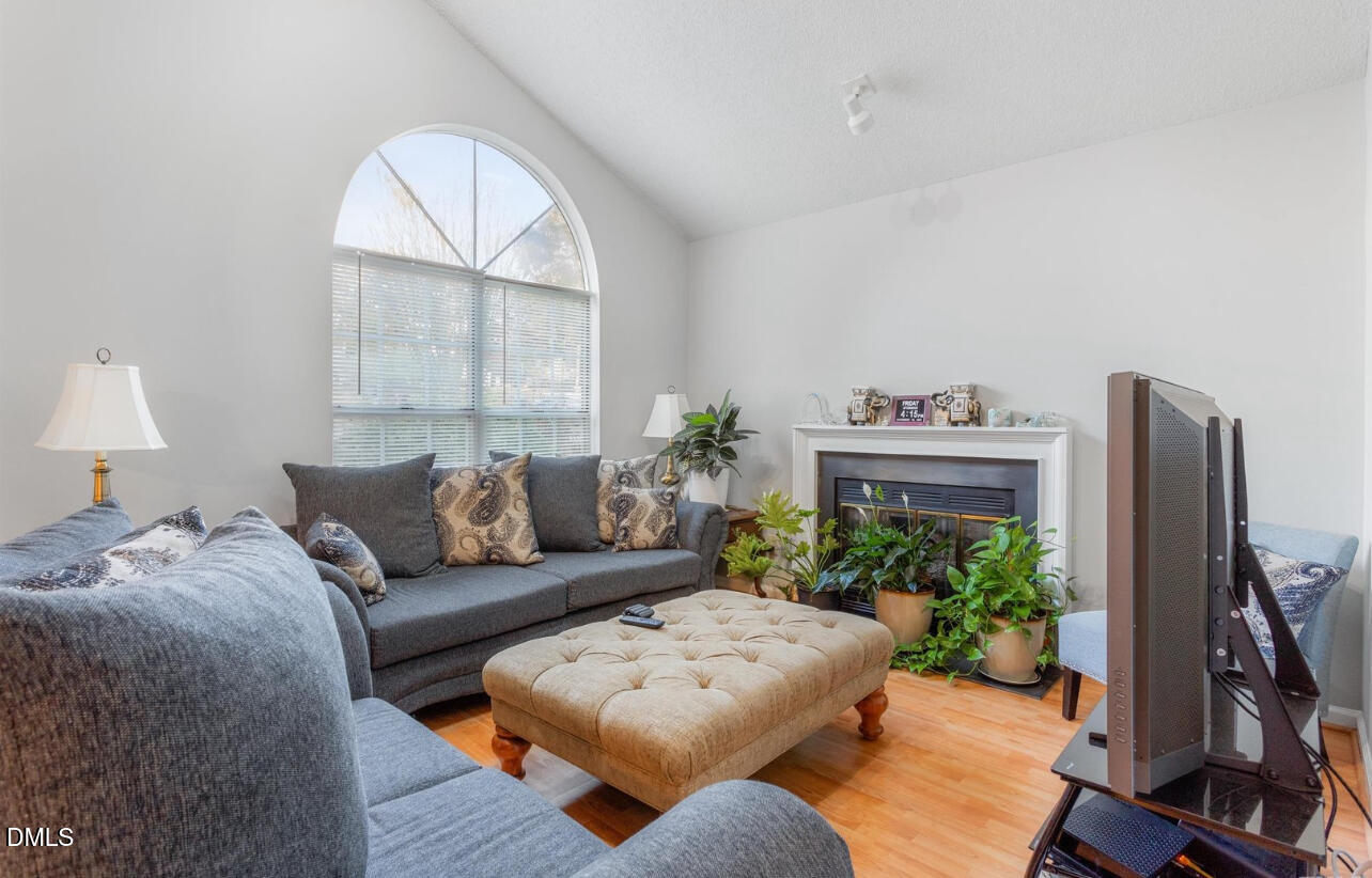 721 Banks Street Graham, NC 27253 - Photo 4 of 4 a living room with furniture potted plant and a large window