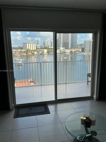 a view of a black and white wooden floor with a floor to ceiling window