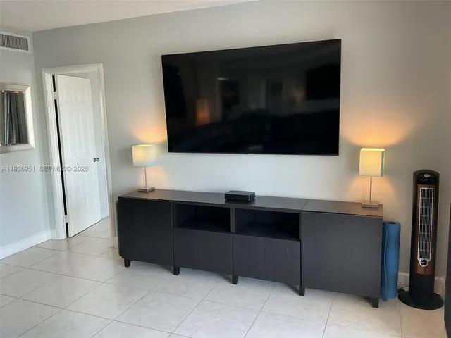 a living room with a couch and a flat screen tv