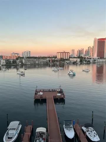 a view of a lake with tall buildings