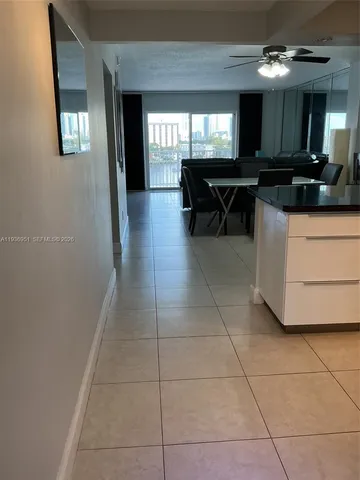 a view of a entryway with furniture and chandelier