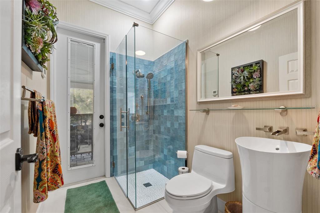 13137 Lake Butler Boulevard Windermere, FL 34786 - Photo 27 of 98 a bathroom with a toilet a sink and shower