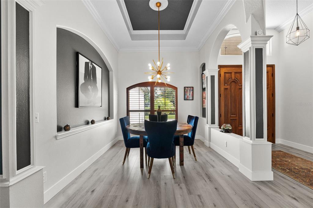 13137 Lake Butler Boulevard Windermere, FL 34786 - Photo 28 of 98 a view of a dining room with furniture window and wooden floor