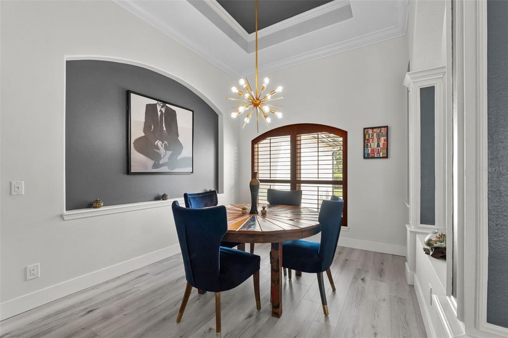 13137 Lake Butler Boulevard Windermere, FL 34786 - Photo 29 of 98 a view of a dining room with furniture and chandelier