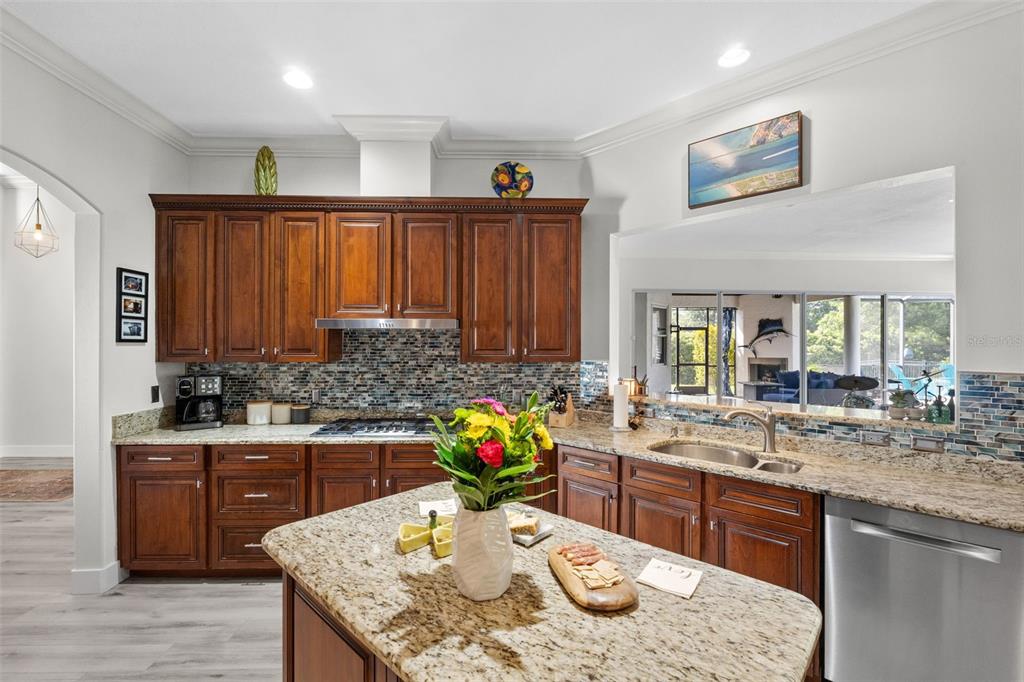13137 Lake Butler Boulevard Windermere, FL 34786 - Photo 32 of 98 a kitchen with a stove a sink and a refrigerator