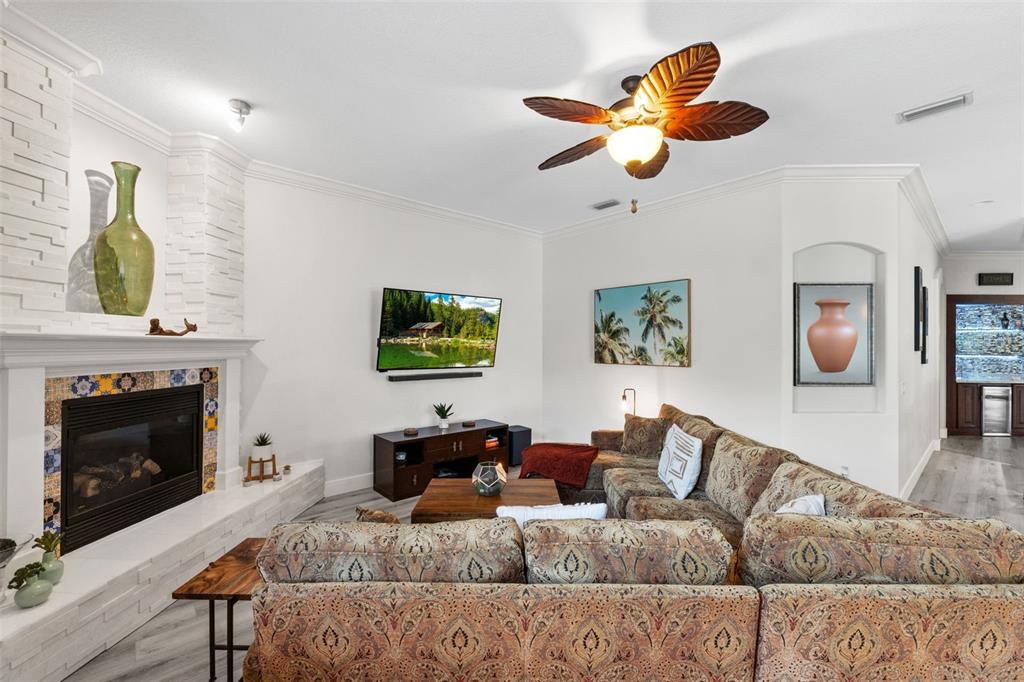 13137 Lake Butler Boulevard Windermere, FL 34786 - Photo 38 of 98 a living room with furniture and a fireplace