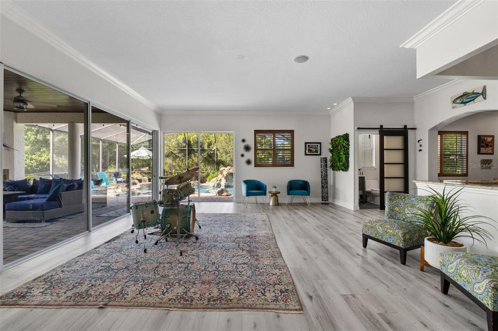13137 Lake Butler Boulevard Windermere, FL 34786 - Photo 44 of 98 a living room with furniture wooden floor and a rug