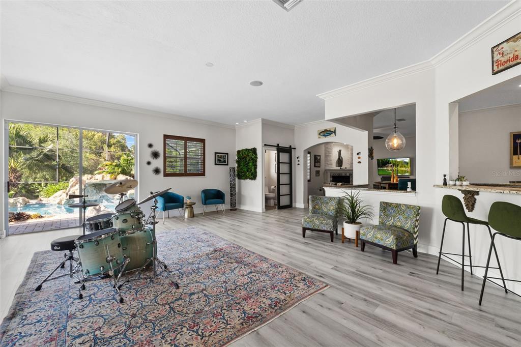 13137 Lake Butler Boulevard Windermere, FL 34786 - Photo 45 of 98 a living room with furniture large window and wooden floor