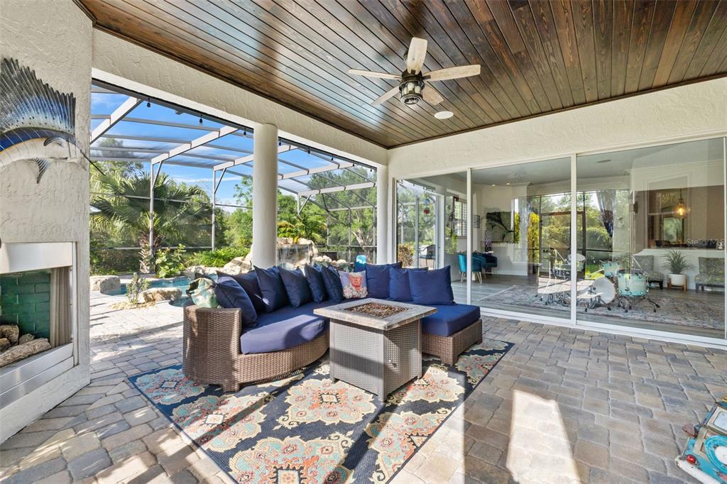 13137 Lake Butler Boulevard Windermere, FL 34786 - Photo 48 of 98 a living room with patio furniture and a floor to ceiling window