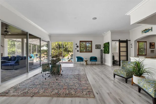 an aerial view of a house with a garden and lake view