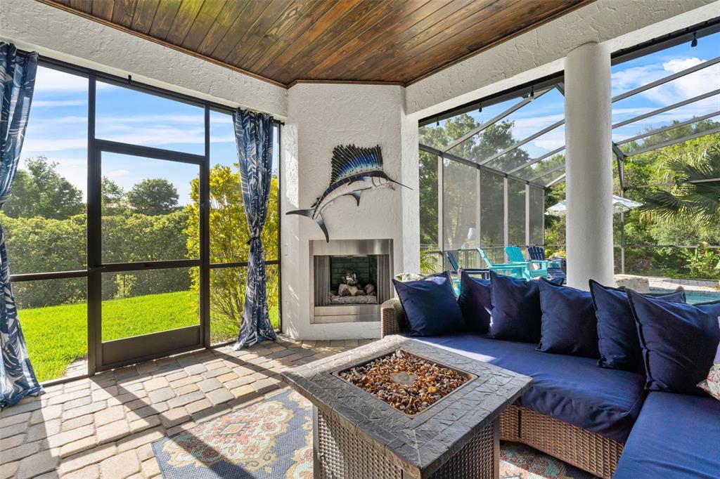 13137 Lake Butler Boulevard Windermere, FL 34786 - Photo 49 of 98 a living room with furniture and a fireplace