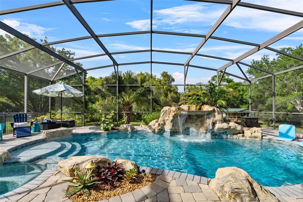 13137 Lake Butler Boulevard Windermere, FL 34786 - Photo 56 of 98 a view of a chairs and table in patio with a backyard