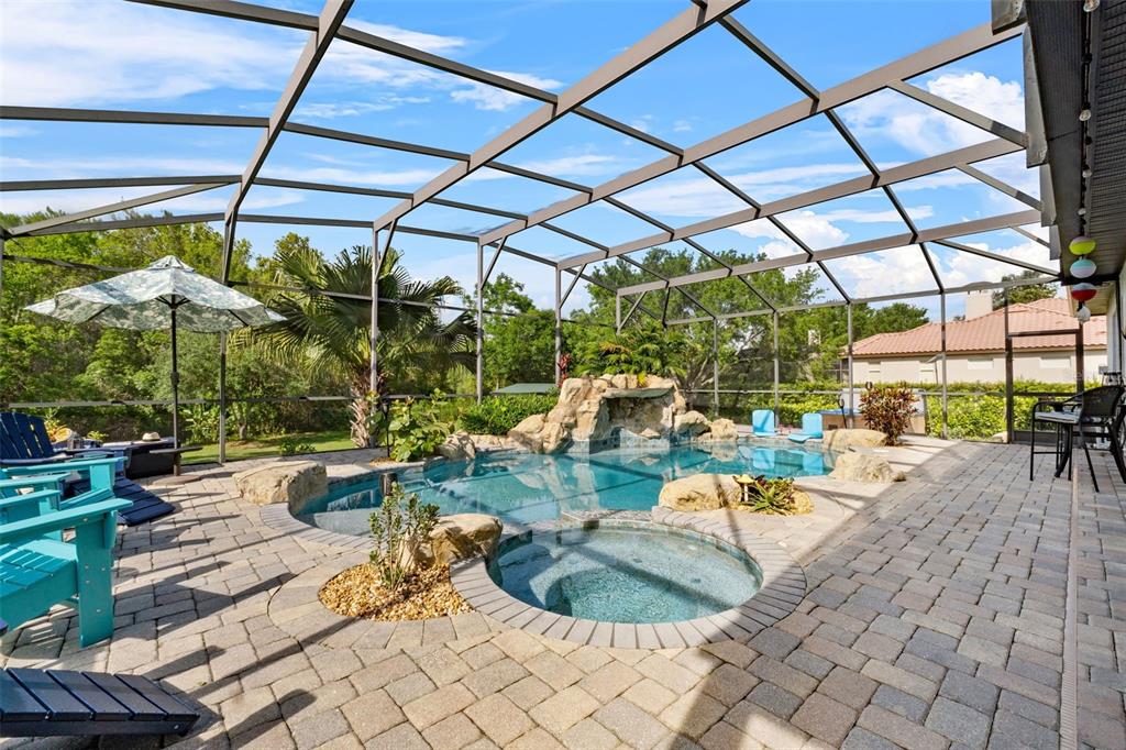 13137 Lake Butler Boulevard Windermere, FL 34786 - Photo 60 of 98 a view of a swimming pool with a patio