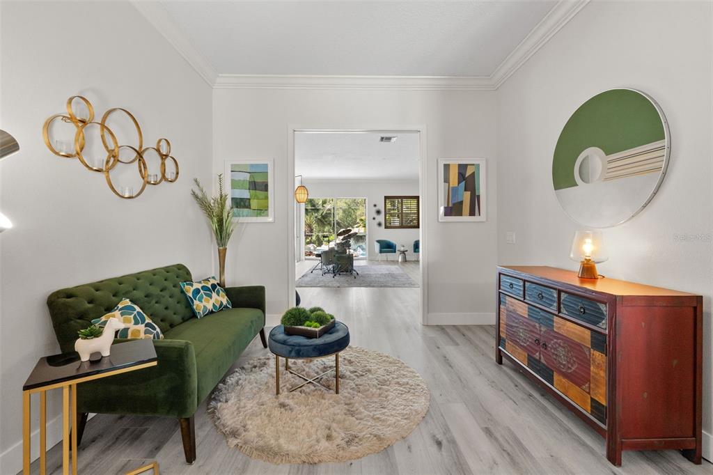 13137 Lake Butler Boulevard Windermere, FL 34786 - Photo 6 of 98 a living room with furniture and a wooden floor