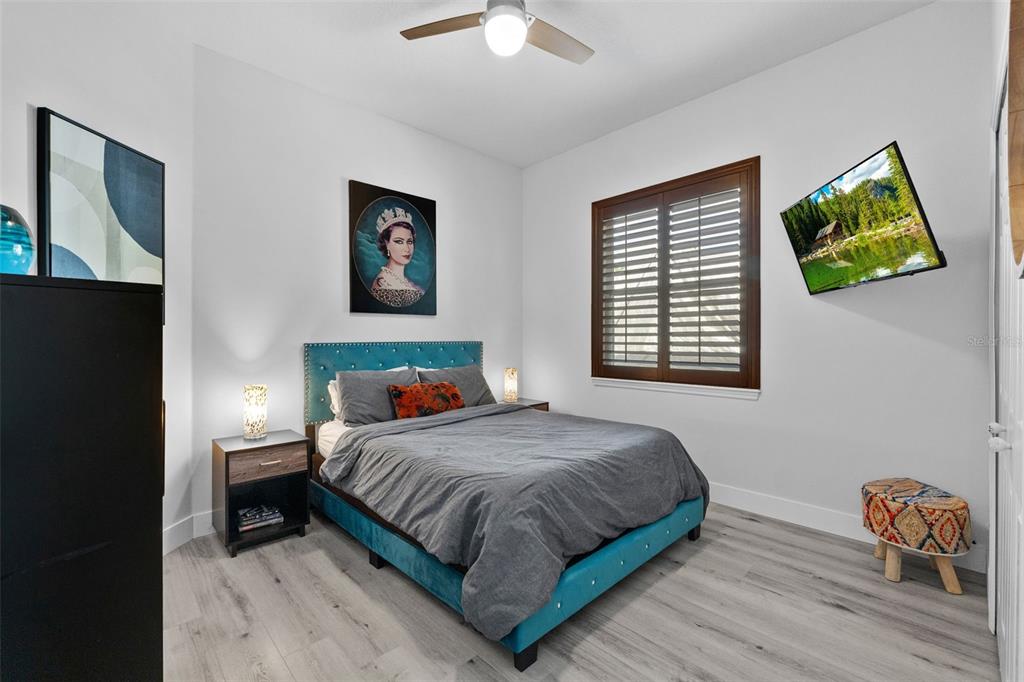 13137 Lake Butler Boulevard Windermere, FL 34786 - Photo 77 of 98 a bedroom with a bed and a window