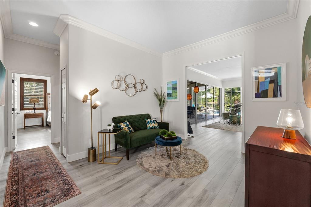 13137 Lake Butler Boulevard Windermere, FL 34786 - Photo 8 of 98 a living room with furniture and wooden floor